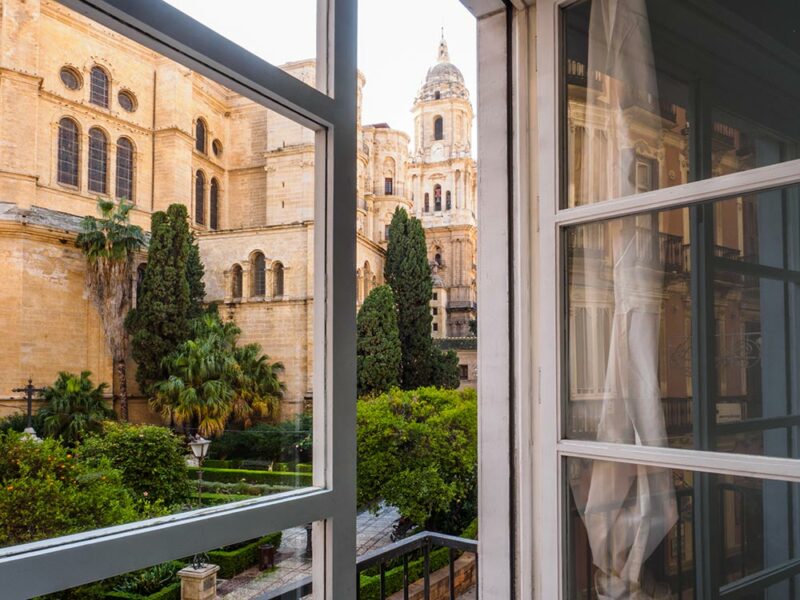 Executive digital nomads can enjoy an excellent quality of life in Malaga. Image shows a view of the cathedral from a rental apartment in Malaga